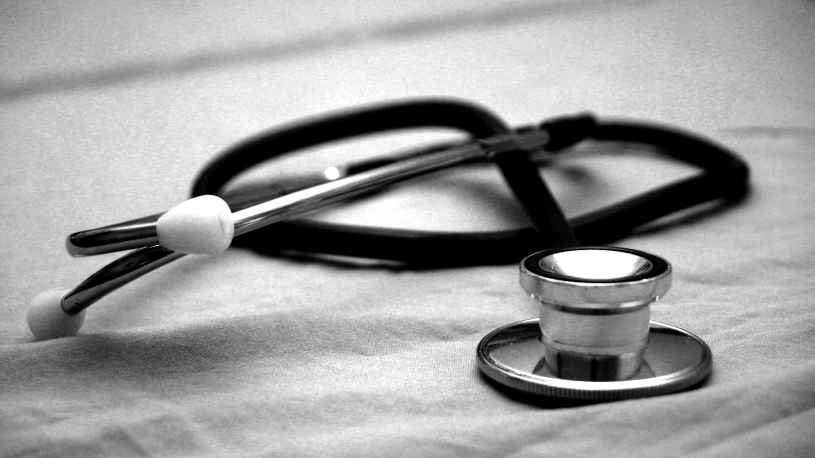 Stethoscope resting on a plain background
