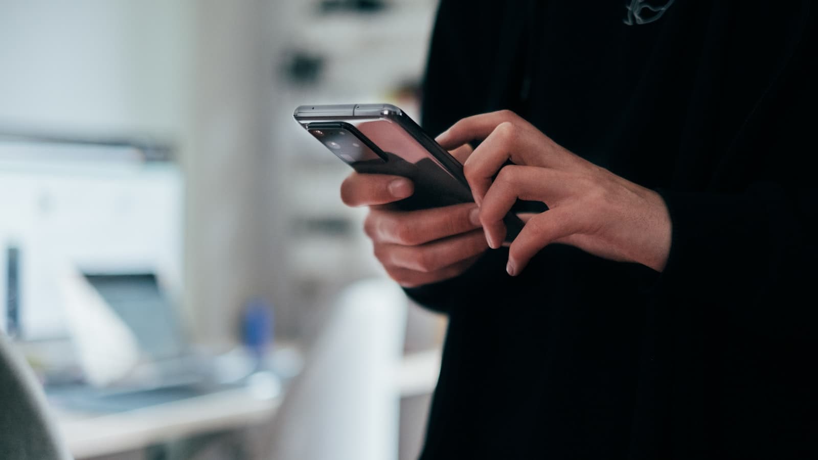Person checking their banking app on a smartphone